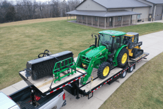 Behnke Trailer with farm equipment loaded on it
